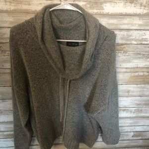 Grey cowl neck sweater.